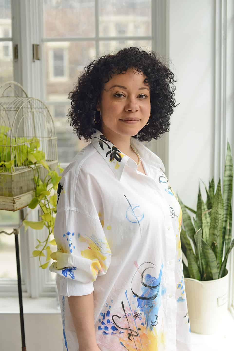 Certified naturopathic doctor Dr. Lydia Thurton ND in a bright, herbal-filled office. Holistic health and natural medicine expert.
